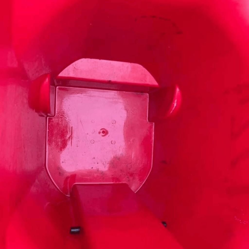 After photo of cleaned red trash bin interior