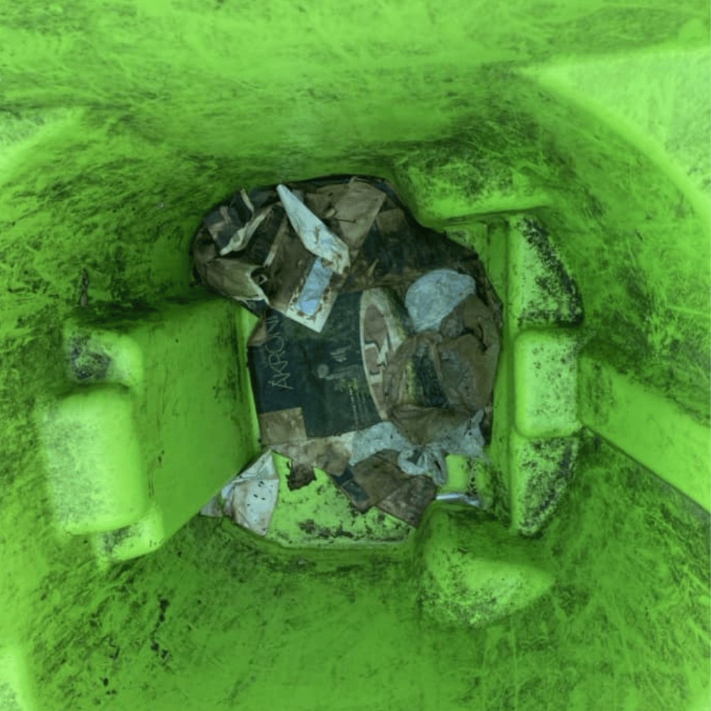 Before photo of dirty green trash bin interior